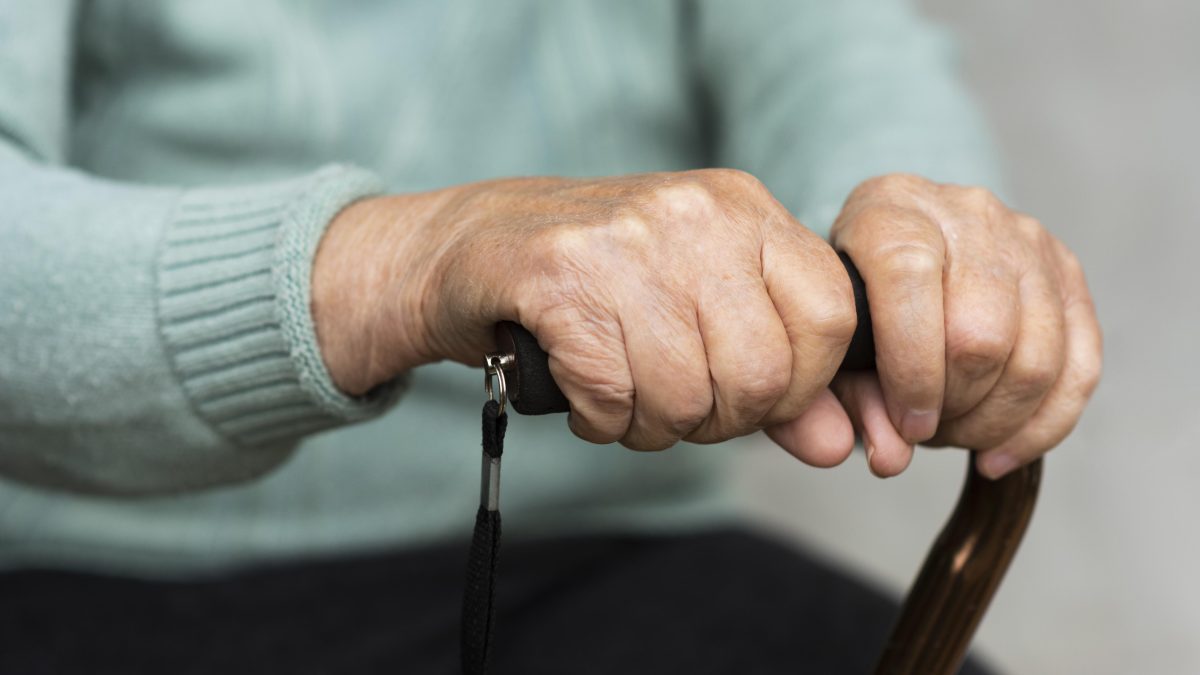 older-woman-holding-cane-hands.jpg