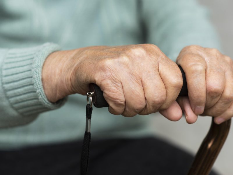 older-woman-holding-cane-hands.jpg