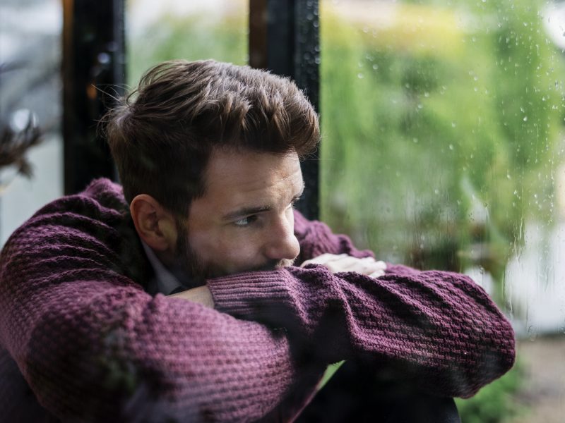 thoughtful-man-looking-out-window.jpg