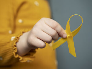 news_d_child-holding-yellow-ribbon-1--6488.jpg